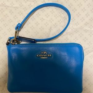 Bright blue coach wristlet